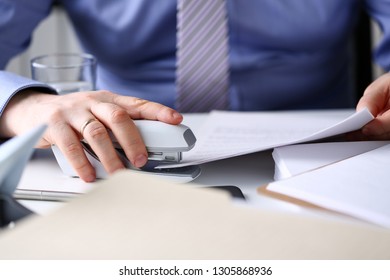 Male Clerk Arm Pin Together Some Papers With Stapler Closeup. Handy Payroll Fastener Bookkeeper Sheet Organization Concept