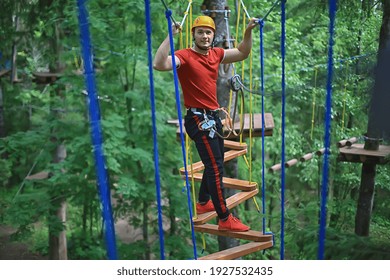 male climber rope park, outdoor activity training, guy, man extreme weekend in the forest - Powered by Shutterstock