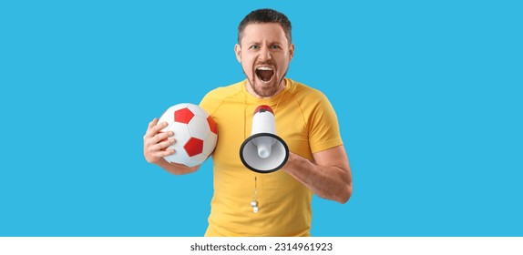 Male coach with soccer ball and megaphone on blue background - Powered by Shutterstock