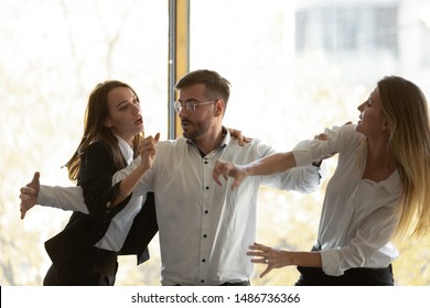 Male Colleague Set Apart Two Envious Jealous Aggressive Business Women Coworkers Fighting At Corporate Office Meeting, Angry Female Rivals Have Bad Relation Competition Conflict Violence At Workplace