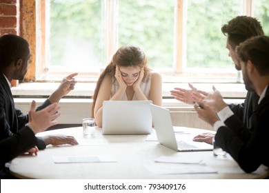 Male colleagues pointing fingers at upset female boss on meeting, tired sad woman leader experiencing gender discrimination at work, businessmen blaming bullying depressed businesswoman for mistake