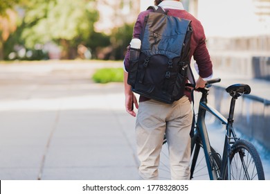 Male Commuter Or Messenger With A Bike In Urban Background. Safe Cycling In The City, Going To Work By Bicycle, Delivery Man Image