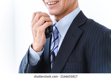 Male Conductor Making An Announcement Inside The Train