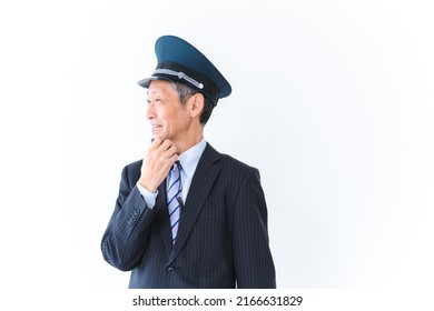 Male conductor making an announcement inside the train