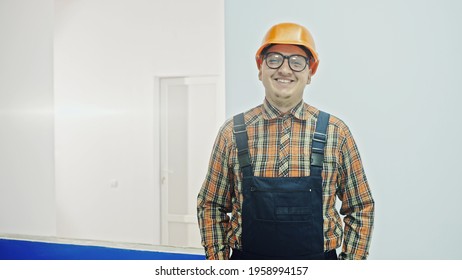 Male construction worker at a building site smiling