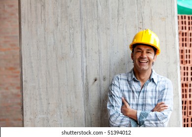 Male Construction Worker At A Building Site Smiling