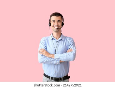 Male consultant of call center with headset on pink background - Shutterstock ID 2142752921