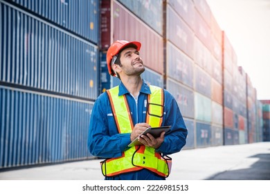 Male Container yard worker using tablet for control loading Containers box from Cargo at container yard. Shipping import export industry Logistics business. - Powered by Shutterstock