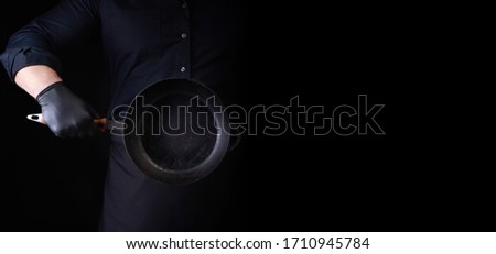 Similar – Image, Stock Photo empty black round frying pan with handle and spoon