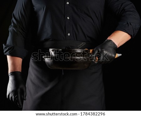 Similar – Image, Stock Photo empty black round frying pan with handle and spoon