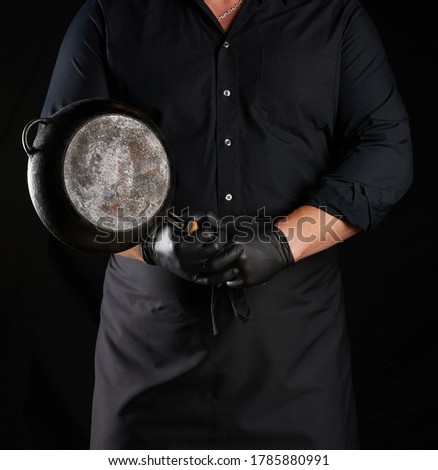 Similar – Image, Stock Photo empty black round frying pan with handle and spoon