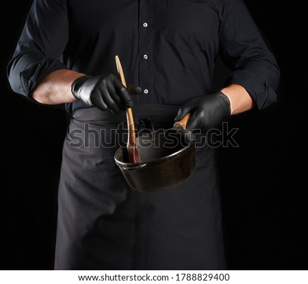 Similar – Image, Stock Photo empty black round frying pan with handle and spoon