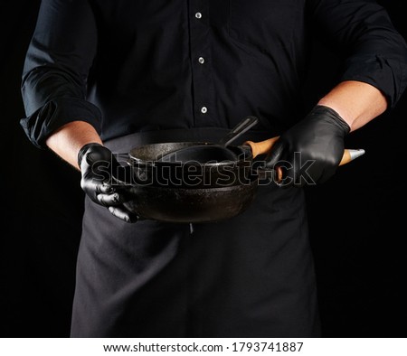 Similar – Image, Stock Photo empty black round frying pan with handle and spoon