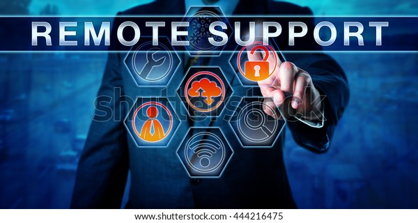 Male Corporate Technician Pressing Remote Support Stock Photo