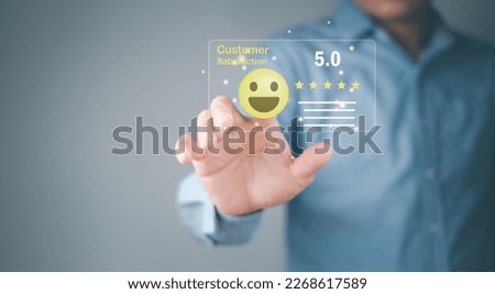 Male customer hand touching 5 star service rating icon. Service exceeds expectations with popup five star icon for satisfaction review service. Customer Experience and Business Satisfaction Surveys Foto d'archivio © 