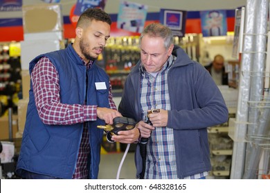 Male Customer In A Hardware Store With Seller