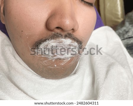 Similar – Image, Stock Photo Anonymous tattoo artist applying transfer paper on client’s back