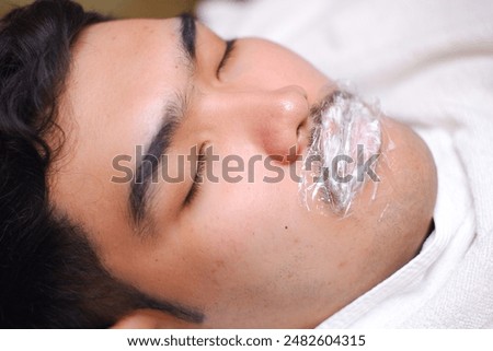 Similar – Image, Stock Photo Anonymous tattoo artist applying transfer paper on client’s back