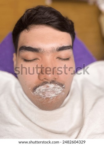 Similar – Image, Stock Photo Anonymous tattoo artist applying transfer paper on client’s back