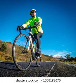 Male Cyclist In High Vis Cycling Jacket Shot Low