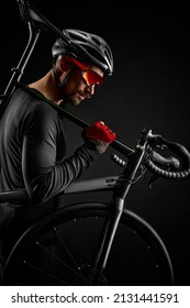 Male Cyclist With Road Bicycle On Black Background