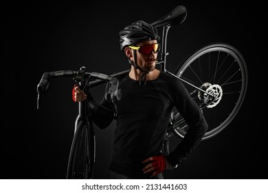 Male Cyclist With Road Bicycle On Black Background