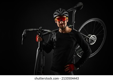 Male Cyclist With Road Bicycle On Black Background