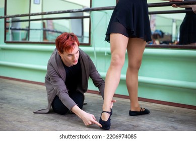 Male dance tutor with female dancer explaining how to perform moves and gimmicks correctly. Learning to dance - Shutterstock ID 2206974085