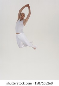 Male Dancer Leaping In Hands Together