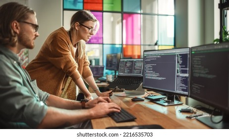 Male Data Scientist and Female Developer Working With Errors in Code on Desktop Computer in Creative Office. Caucasian Man and Woman Succesfully Fixed a Software Bug And High Five Each Other.