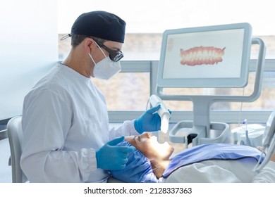 Male Dentist Performing A Scan For The 3d Model Of A Female Patient's Mouth. Dental Clinic Concept