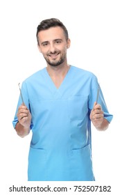 Male Dentist With Tools On White Background