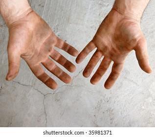 male dirty hands over gray concrete background