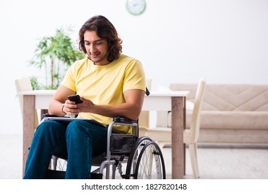 Male disabled student preparing for exams at home - Powered by Shutterstock