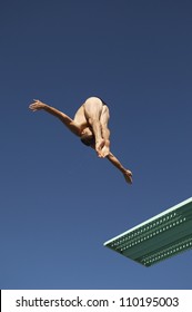 Male Diver Diving Of A Spring Board