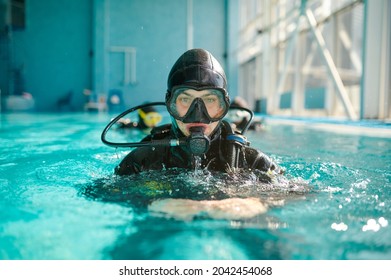 Male Diver In Scuba Gear And Mask Poses In Pool