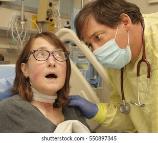 Male Doctor Calms Worried Female Patient Recovering After Surgery In Post Operative Care Room In Modern Hospital