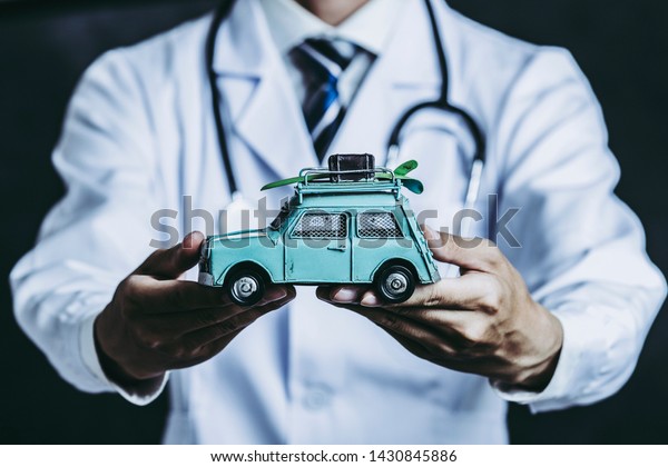 Male doctor with car\
model