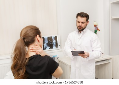 Male Doctor Examining Female Patient Suffering From Neck Pain. Medical Exam. Chiropractic, Osteopathy, Post Traumatic Rehabilitation, Sport Physical Therapy. Alternative Medicine, Pain Relief Concept.