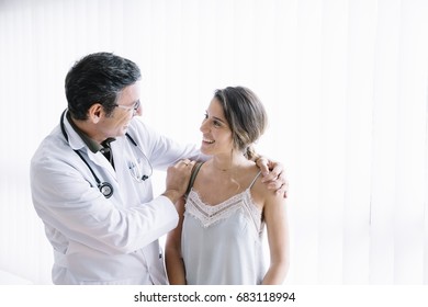 Male Doctor With Female Patient 