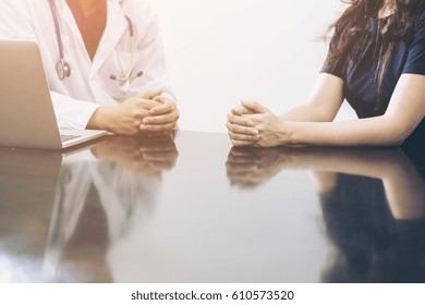 Male Doctor And Female Patient Talking On The Office Desk Showing Health Problem Communication Between Patient And Doctor.