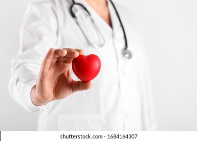 Male Doctor Holding Heart In Hands Symbol Of Health