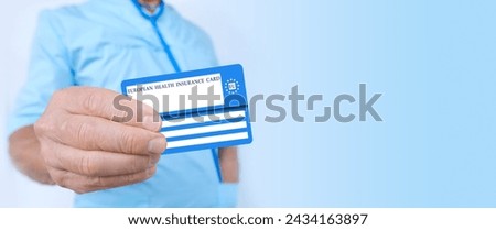 male doctor holds electronic public health insurance cheaper, Insurance Card EU, concept healthcare assistance, medical support on trip to Europe, emergency treatment services, healthcare safety