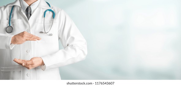 Male Doctor At Hospital Opening Hand Palm To Build Copy Space For Your Text And Design. Medical Healthcare Business And Doctor Service.