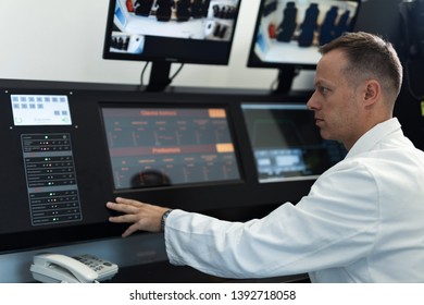 Male Doctor Monitoring Hyperbaric Oxygen Therapy Process From Control Room. 