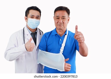 Male Doctor And Old Man With Broken Arm On White Background.