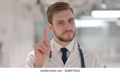 Male Doctor Showing No Sign with Finger Gesture