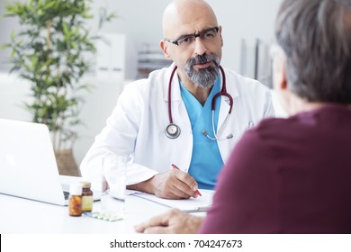 Male Doctor Talking To Patient