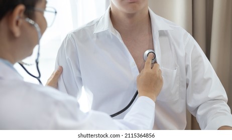 Male doctor uses a stethoscope to check his breathing and lung health to check the patient's initial symptoms, Attending an annual health check in a hospital or clinic, Healthcare and medical concept.