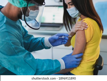 Male Doctor Vaccine A Young Woman Patient Shoulder - Vaccination Against Coronavirus Pandemic